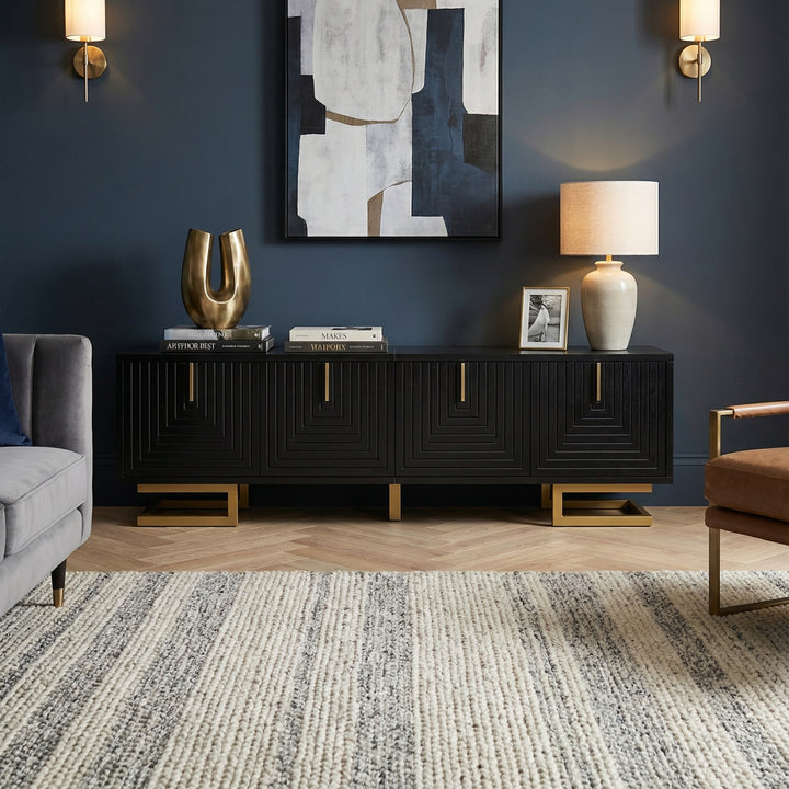 Modern TV stand with textured doors and golden accents SINGULARITYHUB