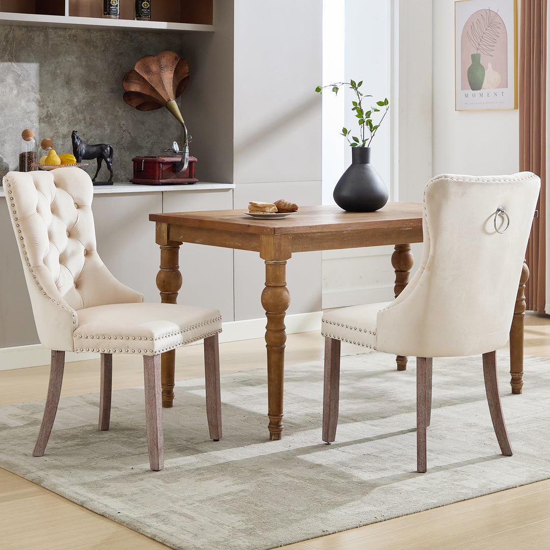 Set of 2 upholstered velvet beige dining chairs button tufted with ring knocker wooden legs TASTRAN BEIGE UK