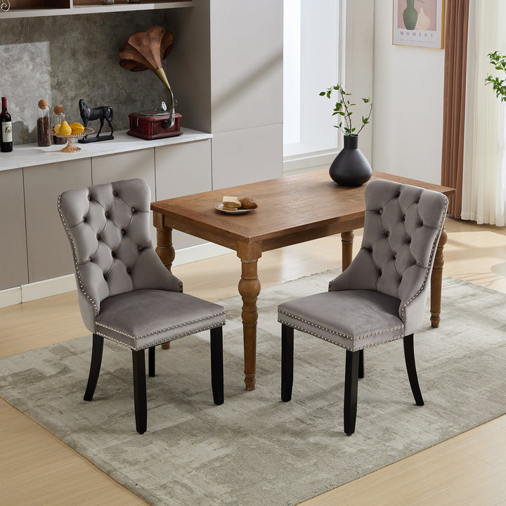 Set of 2 upholstered velvet grey dining chairs button tufted with ring knocker wooden legs TASTRAN GREY UK