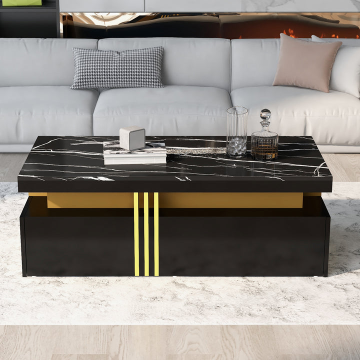 Modern black coffee table with marble-pattern top golden accents LEDGER