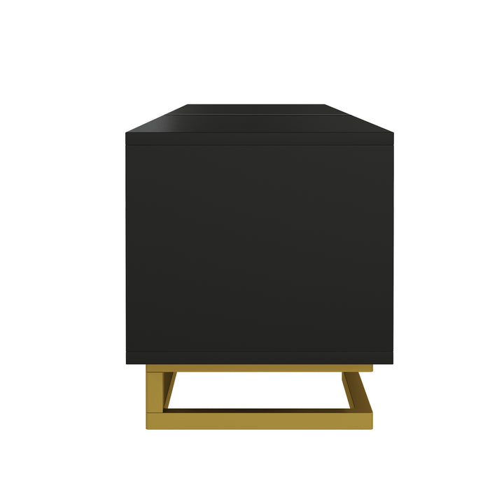 Modern TV stand with textured doors and golden accents SINGULARITYHUB