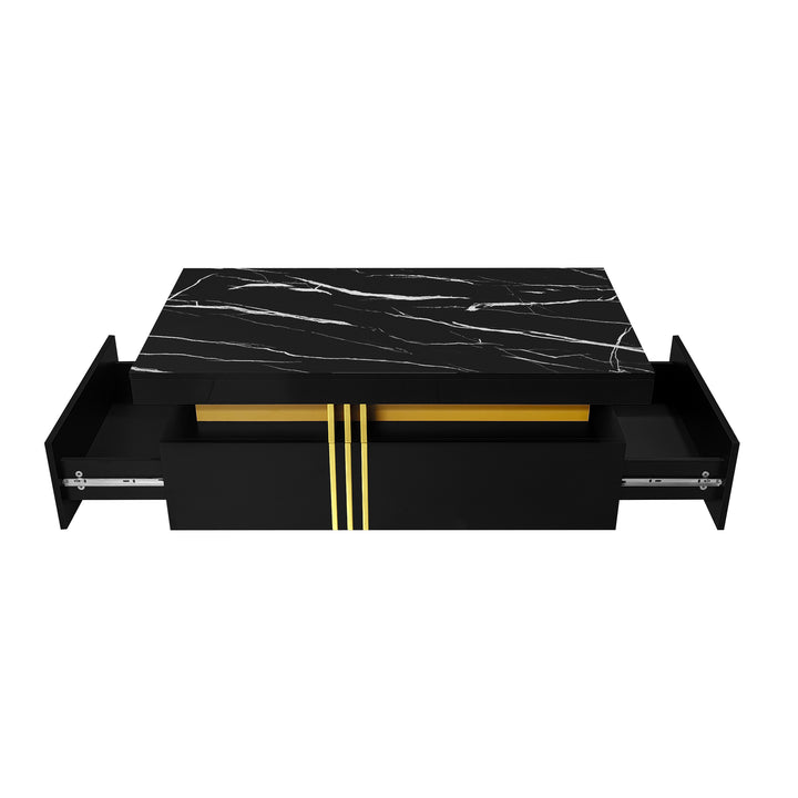 Modern black coffee table with marble-pattern top golden accents LEDGER