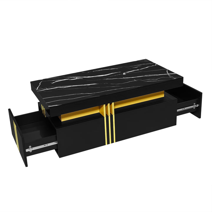Modern black coffee table with marble-pattern top golden accents LEDGER